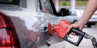 Why Cheap Oil Doesn’t Mean Cheap Gas A person refueling a car at a gas station