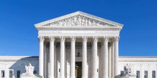 DNI Rush Masks a Bigger Surveillance Fight The Supreme Court building featuring marble columns and a clear blue sky