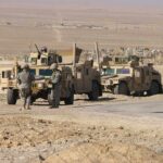New Gaza on Israel’s Border? Two military humvees with soldiers in a desert landscape