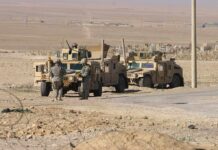 New Gaza on Israel’s Border? Two military humvees with soldiers in a desert landscape