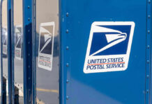 USPS Rule Could Turbocharge Handgun Sales Blue USPS mail collection boxes in a row.