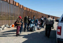 How the Big Beautiful Bill Supercharged ICE Border patrol agents interact with a group of people.