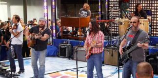 Near-Death Miss On Trump Rehearsal Stage A band performing live on stage with an audience in front