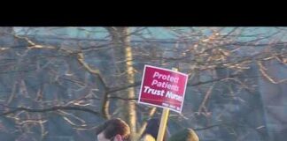 ICE Detention Triggers Hospital Protest Nurses at EMMC picketing