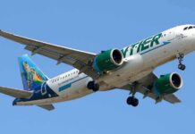 4 Crew Members Mysteriously Fall Sick Midair on Florida Flight Airliner with green engines flying against a clear blue sky