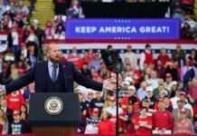 GOP Revolt Builds — Miller Wires $1M Speaker at podium addressing large crowd at political rally