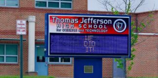 Parents vs. Schools: Faith Clash Explodes Electronic school marquee in front of a brick high school