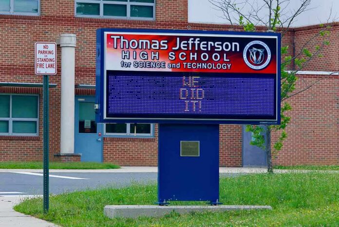 shutterstock_1989957131 Electronic school marquee in front of a brick high school