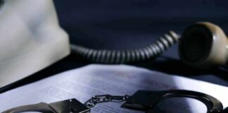 Starvation Death, Walks On Probation Handcuffs on a document beside a coiled telephone handset