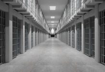 Shocking Taunts Inside Texas Detention Prison corridor lined with barred cells on both sides