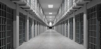 Shocking Taunts Inside Texas Detention Prison corridor lined with barred cells on both sides