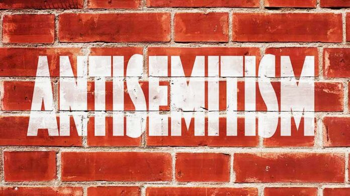 Brick wall with large white stencil text
