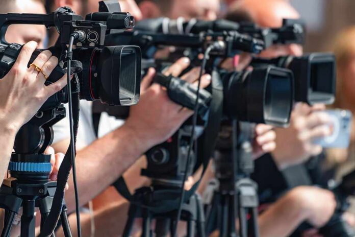 Camera,Recording,At,A,Media,Press,Conference,Preserves,Accurate,Details television cameras on tripods at a media event