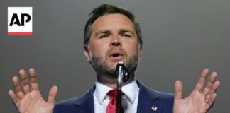 JD Vance confronts a protester during his Republican midterm convention speech