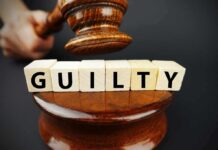 Judge's gavel above blocks spelling guilty