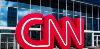 CNN Retraction Fallout – Hoax Claim Crumbles CNN red logo sculpture outside a modern glass building