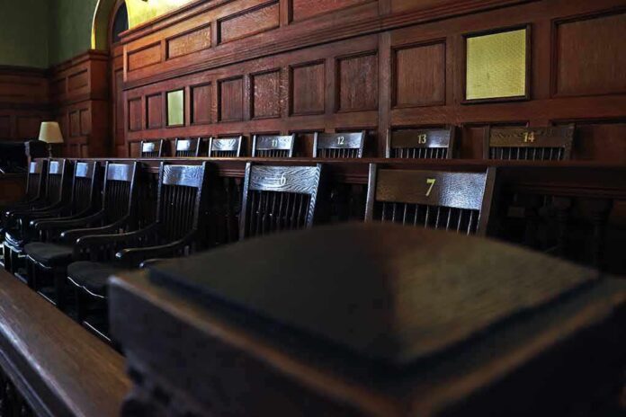 Empty wooden jury box with numbered chairs