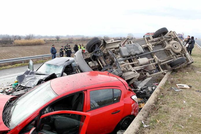 shutterstock_125539172 Overturned truck and damaged cars after highway crash