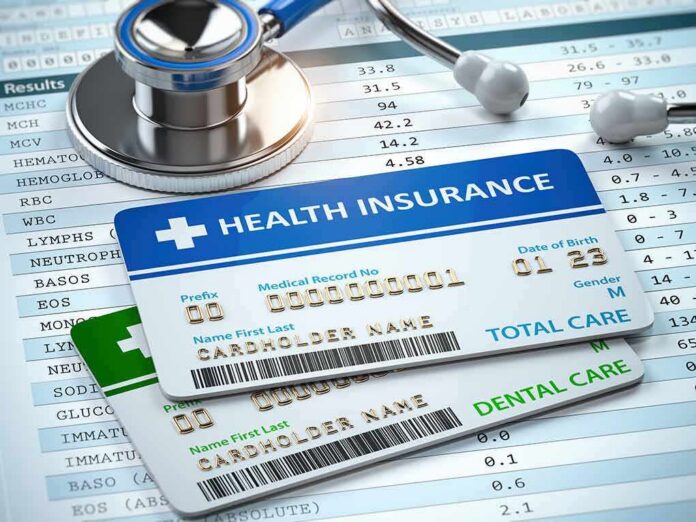 Health insurance cards on medical forms with stethoscope