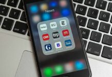 California’s Gag Law? Press Freedoms on Trial Smartphone displaying a folder of news apps on a laptop keyboard