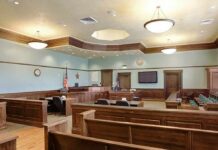 Shocking Mistrial After 6 Weeks Of Experts Empty courtroom with wooden benches and judge's bench