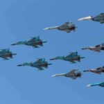 Trump and Vance Downplay Iran A formation of military jet fighters flying in a clear blue sky