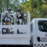 Police Find Cartel ‘Hospital’ Hidden in Jalisco National guard officers standing on a patrol truck