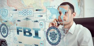 Man on phone behind digital interface with FBI and cybersecurity graphics