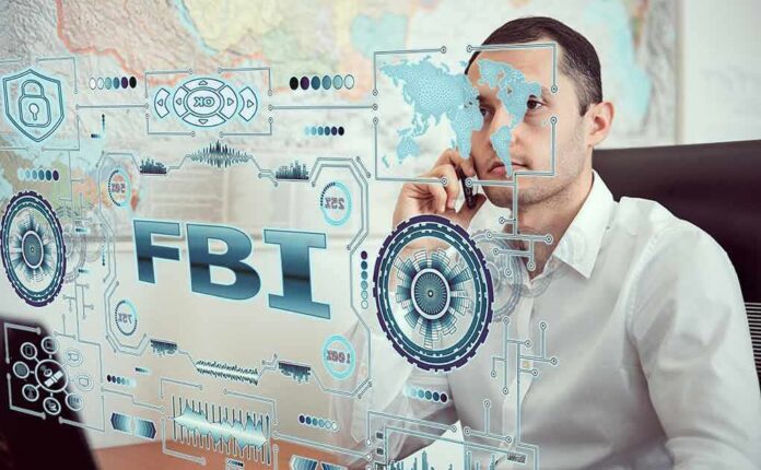 shutterstock_1650133459 Man on phone behind digital interface with FBI and cybersecurity graphics