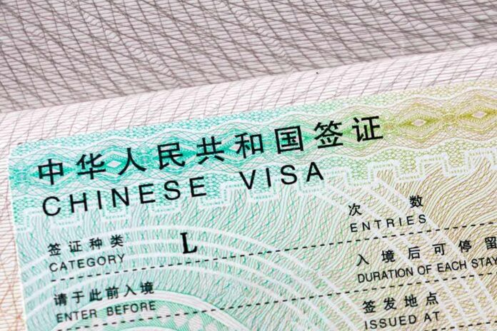 shutterstock_1730072584-1 Chinese visa document close-up