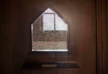 Confessional booth window with lattice screen