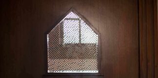 Confessional booth window with lattice screen