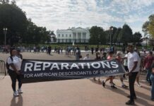 Reparations Activists Turn on Blue States Protesters hold a reparations banner outside the White House