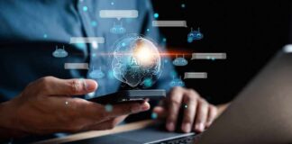 Person using smartphone and laptop with AI hologram