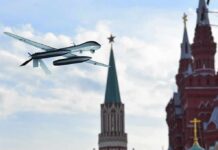 Ukraine Fires Over 1,000 Drones at Russia military drone flying near ornate red-brick towers