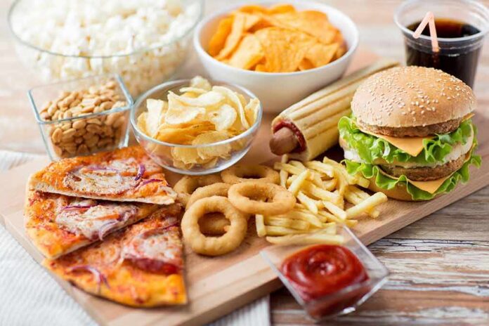 Assorted fast food on a wooden board