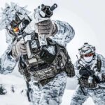 Soldiers in winter camo advancing with rifles in snowy terrain