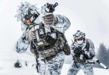 USA to Build ‘Large Military Presence’ in Greenland Soldiers in winter camo advancing with rifles in snowy terrain