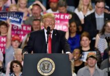 Trump Money Bomb Hits Texas speaker at podium addressing a crowd