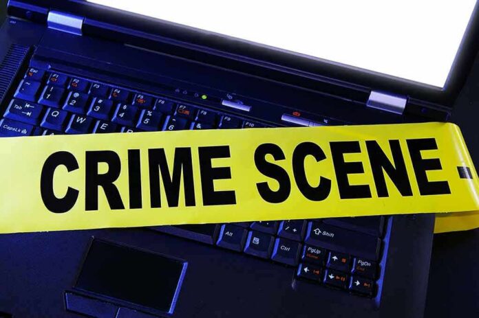 Laptop keyboard with yellow crime scene tape across it