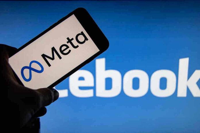 Meta on phone screen, Facebook in background.