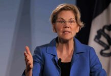 Warren CORNERED on Who Funds Democrats Elizabeth Warren speaking at an event with a flag in the background