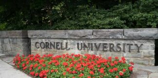 Cornell Case Gets a POWERFUL New Prosecutor Cornell University stone sign with red flowers