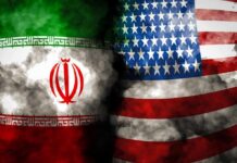 Iran-Linked Boat Caught STALKING U.S. Warships Iran and United States flags with smoky overlay