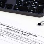 The 4.2% Jobs Number Is HIDING Something Unemployment benefits application form with keyboard and pen