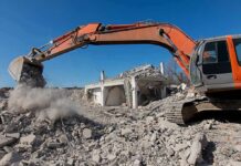 79-Year-Old’s Home BULLDOZED While Out Shopping Excavator demolishing a concrete building