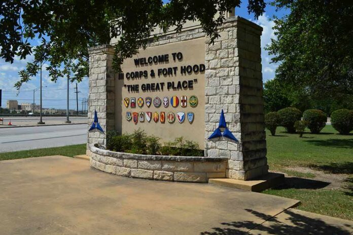 stone entrance sign with military unit emblems