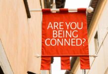 Red hanging banner with bold white text