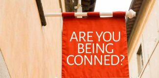 Red hanging banner with bold white text