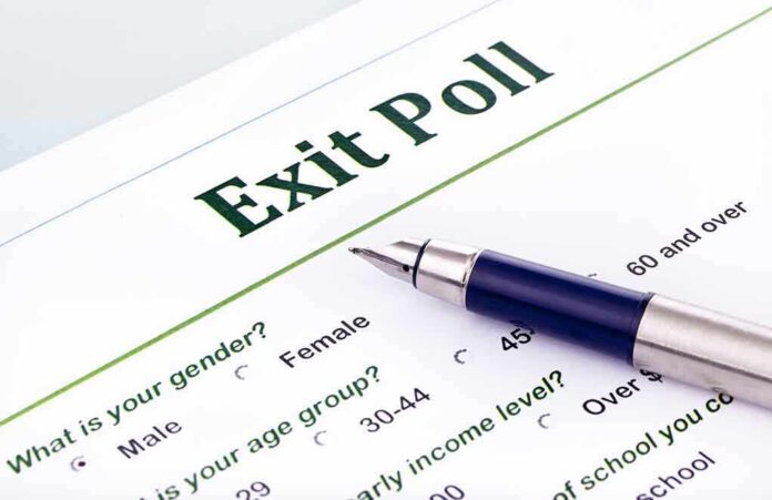 Close-up of an exit poll survey form with a pen